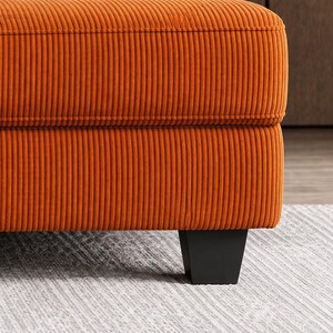 Orange sofa leg detail, black tapered legs, sturdy base modern couch, contemporary living room furniture