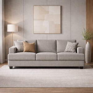 Light gray fabric sofa, neutral modern 3-seat couch, soft upholstery, minimalist Scandinavian living room decor