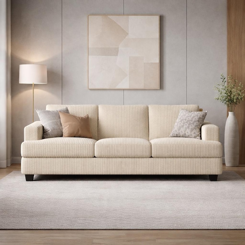 Cream corduroy sofa front view, neutral 3 seater couch with soft cushions, Scandinavian style living room furniture