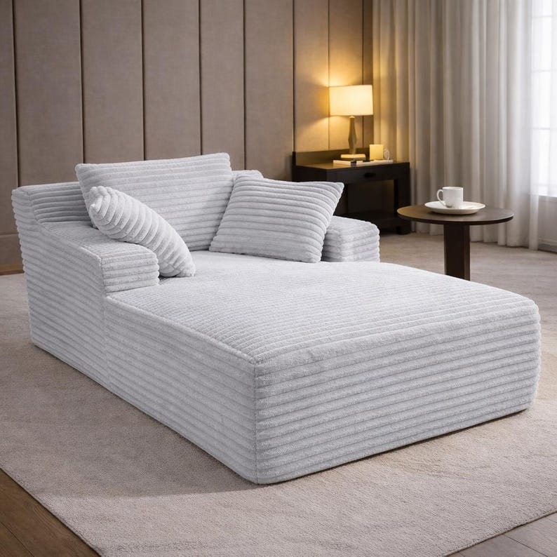Light gray corduroy chaise lounge with soft ribbed texture and wide seating area, designed for everyday comfort.