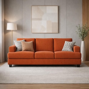 Burnt orange fabric sofa, modern 3-seater couch, textured upholstery, minimalist living room decor, Scandinavian style furniture, neutral interior styling