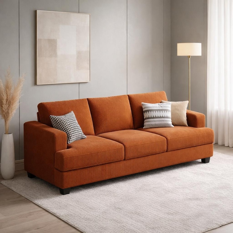 Burnt orange corduroy sofa, modern 3 seater couch with plush cushions, contemporary living room furniture, cozy minimalist decor