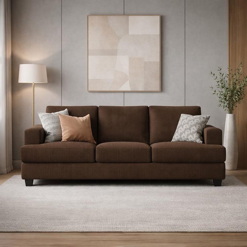 Dark brown corduroy sofa, modern 3-seater couch, cozy textured upholstery, neutral living room styling, contemporary furniture