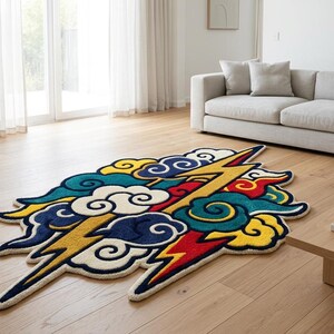 May include: A colorful, cloud-shaped rug with a lightning bolt design. The rug features a combination of blue, yellow, red, and white colors. It is placed on a hardwood floor in a living room setting.