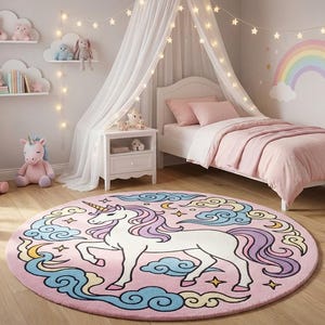 May include: A child's bedroom with a pink and white theme. A round rug with a unicorn design sits on the wooden floor. A bed with pink bedding, a white dresser, and stuffed unicorns complete the scene. Decorative cloud shelves and a rainbow wall decal add to the whimsical decor.