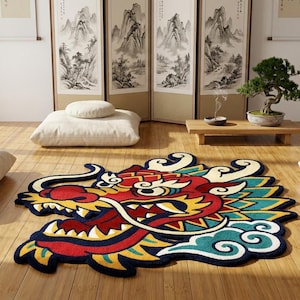 May include: A colorful dragon-shaped rug with red, yellow, blue, and white accents. The rug is placed on a wooden floor in a room with Japanese-style decor, including a bonsai tree and floor cushions.