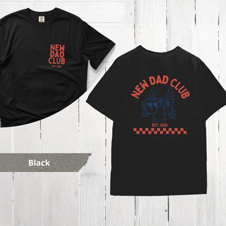 May include: Black t-shirts with the text "NEW DAD CLUB" in red. One shirt has the text on the front, the other on the back with a cartoon coffee cup and baby bottle design in blue. The shirts have the text "EST. 2026".