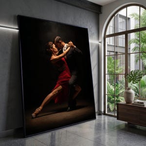 May include: A large framed print of a couple dancing the tango. The woman wears a red dress, and the man is in a black suit. They are in a close embrace, with a dark background and a spotlight effect.