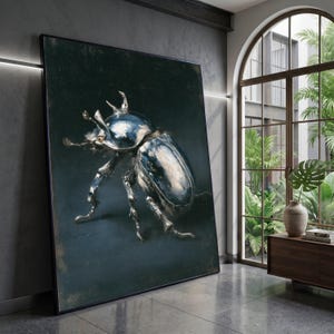 May include: Large framed artwork featuring a detailed, metallic-looking beetle against a dark background. The beetle's body has a reflective, silver-blue sheen. The artwork is displayed in a modern interior with a large window and natural light.