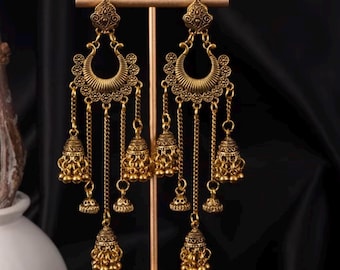 Bohemian-style Indian jhumka dangle drop earrings featuring a gold-tone alloy finish with intricate bell tassels