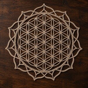 May include: A circular beige crochet doily featuring a geometric flower of life pattern. The intricate design consists of overlapping circles forming a central hexagonal grid, surrounded by a delicate, pointed scalloped border edge.