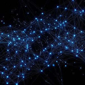 May include: A digital network visualization featuring a cluster of glowing blue nodes connected by thin, intersecting lines against a solid black background, creating a complex web of data points and interconnected pathways throughout the frame.