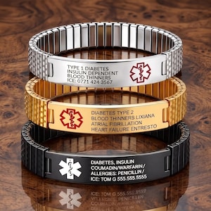 May include: Three medical alert bracelets with expandable metal bands in silver, gold, and black tones. Each features a central rectangular plate engraved with a red or white Star of Life symbol and personalized medical information including conditions.