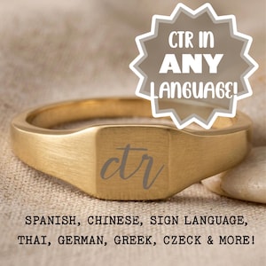 May include: A gold-colored signet ring with the initials "ctr" engraved on the flat surface. The ring is displayed with the text "CTR IN ANY LANGUAGE!" and a list of languages including Spanish, Chinese, and German.