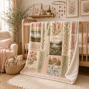 May include: A patchwork quilt featuring floral patterns, landscape scenes, and a cottage illustration with the name willow printed in script. The quilt has a white fleece backing and is draped over a wooden crib in a nursery setting.