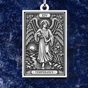 May include: A rectangular silver pendant necklace featuring an engraved illustration of the Temperance tarot card, depicting a winged figure pouring liquid between two cups, with the Roman numeral XIV and the word TEMPERANCE inscribed.