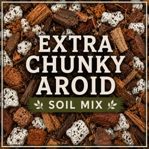 May include: A potting medium consisting of brown wood bark chunks and white speckled perlite pieces. The text "EXTRA CHUNKY AROID SOIL MIX" is printed in large white letters over the centre of the mixture, with a green banner below.