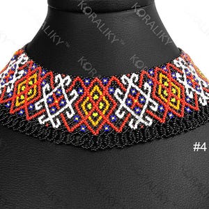 May include: A colourful beaded choker necklace with a black base and patterns in red, yellow, white, and blue. The necklace is displayed on a black mannequin head. The number "4" is visible.