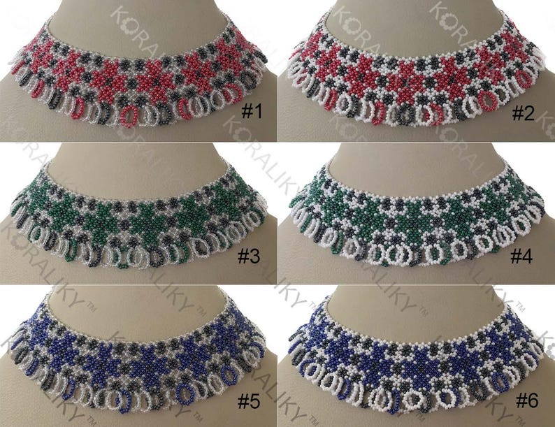 May include: Six beaded necklaces with different colored patterns. The necklaces are white with red, green, blue, and black accents. The necklaces are numbered 1 through 6.