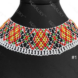 May include: A colourful beaded choker necklace with a geometric pattern. The necklace has a white beaded base with a pattern of red, yellow, green, and black beads. The necklace is displayed on a black mannequin.