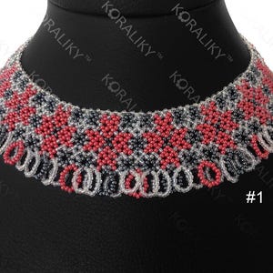 May include: A beaded choker necklace with a geometric pattern in red, black, and white. The necklace is on a black mannequin bust. #1
