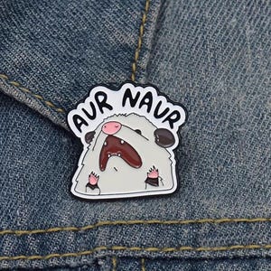 May include: A set of three ceramic mugs with a speckled, matte finish. The mugs are in shades of cream, light gray, and dark gray. Each mug has a simple, minimalist design, perfect for coffee or tea.