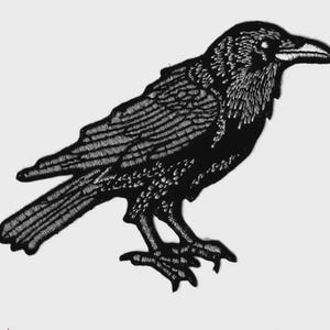 May include: Black embroidered raven patch. The raven is depicted in a side profile, with detailed stitching outlining its feathers, beak, and claws. The patch is designed to be ironed on or sewn onto fabric.