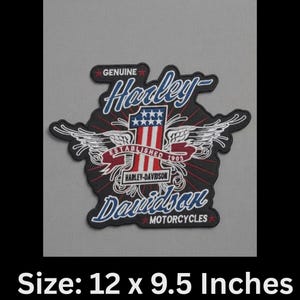 May include: A black, red, white, and blue Harley-Davidson patch with the words "Harley-Davidson Motorcycles" and "Established 1903." The patch features wings and the American flag. Size: 12 x 9.5 inches.