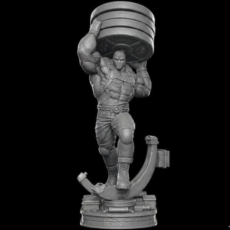 May include: A gray figurine of a muscular figure wearing a mask and lifting a stack of weight plates. The figure is posed on a platform with a stylized support structure. The overall design is detailed and sculpted.