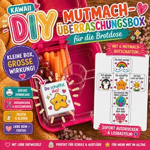 Op de afbeelding: Een roze lunchbox met een doe-het-zelf kit, wortels en druiven. De kit bevat een doosje met een lachende ster en een vel met zes motiverende boodschappen. Tekst op de doos zegt "Je kunt het!" en "Kawaii DIY".