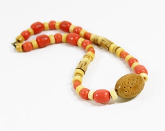 Vintage 1930s celluloid and bone necklace creme and tangerine orange carved beaded choker