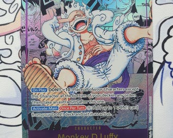 Puede incluir: Carta coleccionable holográfica con Monkey D. Luffy de "One Piece". La carta tiene un borde morado y muestra a Luffy en una pose dinámica con detalles en blanco y azul. El texto incluye "12000" y detalles del personaje.