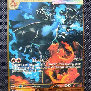 May include: A gold-bordered Mega Charizard X ex trading card featuring a large black dragon with blue flames, a smaller orange dragon, and the text Mega Charizard X ex, HP 10000, Inferno X 900, and various game rules printed on the surface.