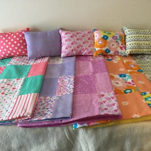 Doll blanket and pillow set, made to fit over dolls up to 18 inches tall. Five different patchwork choices
