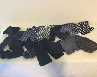 18 inch boy doll,  mix or match outfits in navy blue, includes hooded jacket,  different pants, shorts,  different tops and booties.