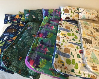 Sleeping bag and pillow set for boy or girl dolls with camping designs.  Choice of three prints, fits up to 18 inch dolls or stuffed animals