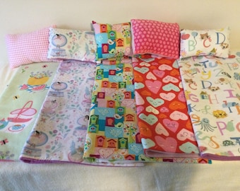 Doll blanket and pillow sets, made to fit most dolls or special friends, up to 18 inches tall. Choice of five prints.