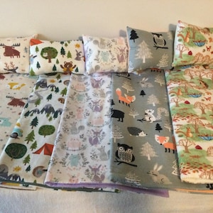 Blanket and pillow set for special friends of boys and girls.  Made to fit most dolls up to 18" tall. Choice of five forest & camping prints