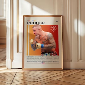 May include: Framed poster featuring Dustin Poirier, a UFC fighter, in a boxing stance. The poster has a gold frame and a color scheme of orange, white, and black. The word "POIRIER" is at the top, along with the year "1989" and a signature.
