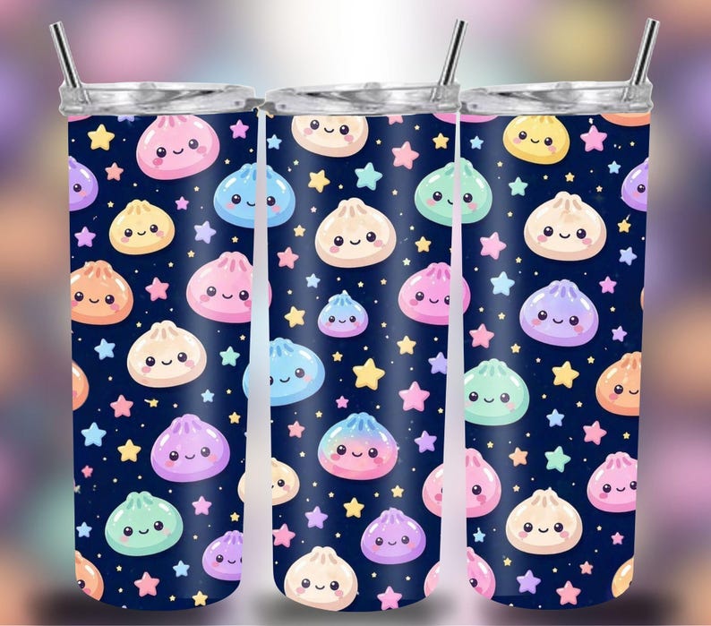 May include: Three stainless steel tumblers with a fun design. The tumblers have a navy blue background decorated with cartoon dumplings and stars in various colours. Each tumbler has a silver lid and a straw.