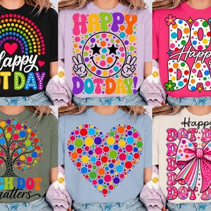 May include: A collection of six t-shirts featuring colorful dot-themed graphics. Designs include a rainbow, a smiley face, the text Happy Dot Day, a tree, a heart, and a large bow, all incorporating vibrant multi-colored polka dot patterns.