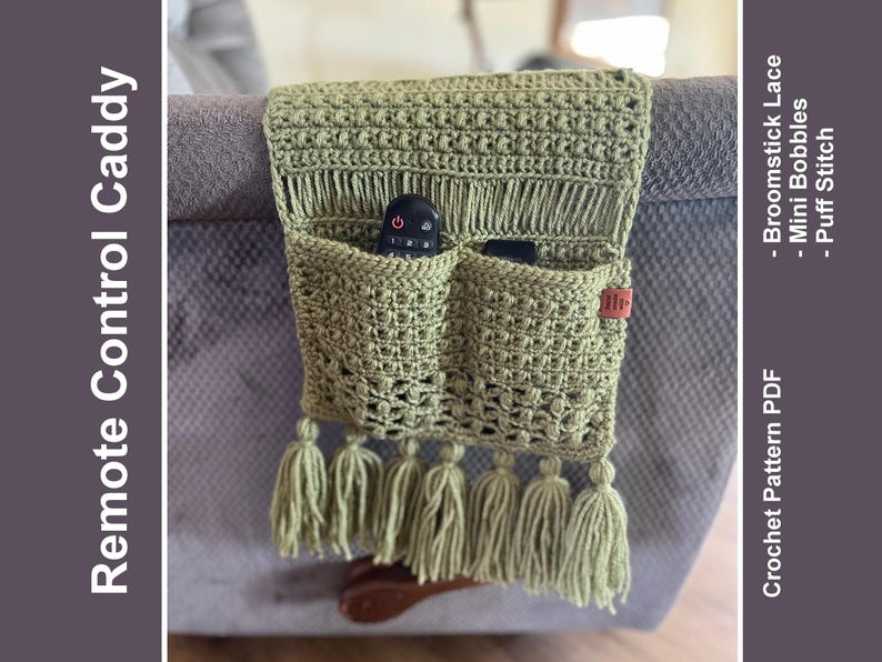 May include: A green crocheted remote control caddy with two pockets and tassels. The caddy is hanging on the arm of a couch. The text on the right side of the image reads "Crochet Pattern PDF -  Broomstick Lace - Mini Bobbles - Puff Stitch".