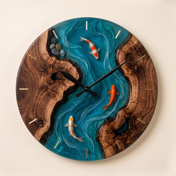 A live-edge wood slab meets deep-pour blue epoxy resin river, with carved koi fish swimming through the clock face — functional sculpture, not just a clock.