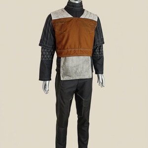 May include: A set of three ceramic mugs with a speckled, matte finish in cream, light grey, and dark grey. Each mug has a simple, minimalist design, ideal for coffee or tea.