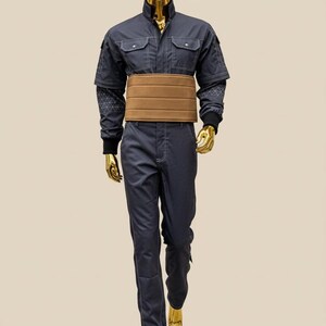 May include: A set of three ceramic mugs with a speckled, matte finish. Each mug is a different colour: light blue, cream, and grey. The mugs have a simple, modern design and a comfortable handle.