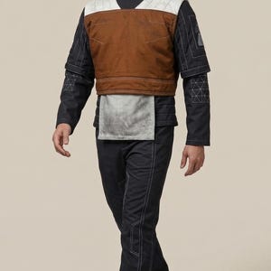 May include: A white ceramic mug with a black handle and the text "But First, Coffee" in a handwritten style. The mug is on a white surface. The mug is approximately 10 cm tall.