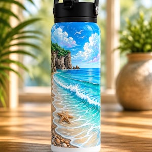 May include: A stainless steel water bottle featuring a vibrant beach scene. The design includes a blue sky with fluffy clouds, a sandy shore, turquoise waves, and a starfish. The bottle has a black handle and lid.