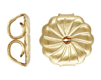 May include: A pair of gold-tone earring backs. One back is a traditional butterfly clasp, the other is a round, textured disc.