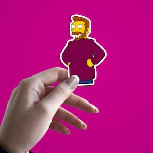 May include: A sticker of a cartoon character with a beard, wearing a maroon sweater and blue trousers, with yellow skin and hair. The sticker is held against a bright pink background.