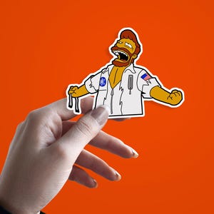 May include: A sticker featuring a cartoon character in a white uniform with a blue emblem and an American flag patch. The character has a brown beard and is yelling with arms outstretched against an orange background.